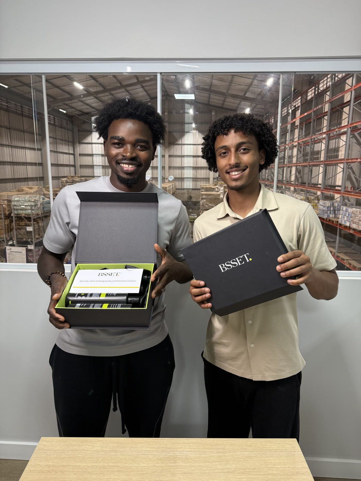 Mo and Ibby, BSSET co-founders, with BSSET boxes at the warehouse